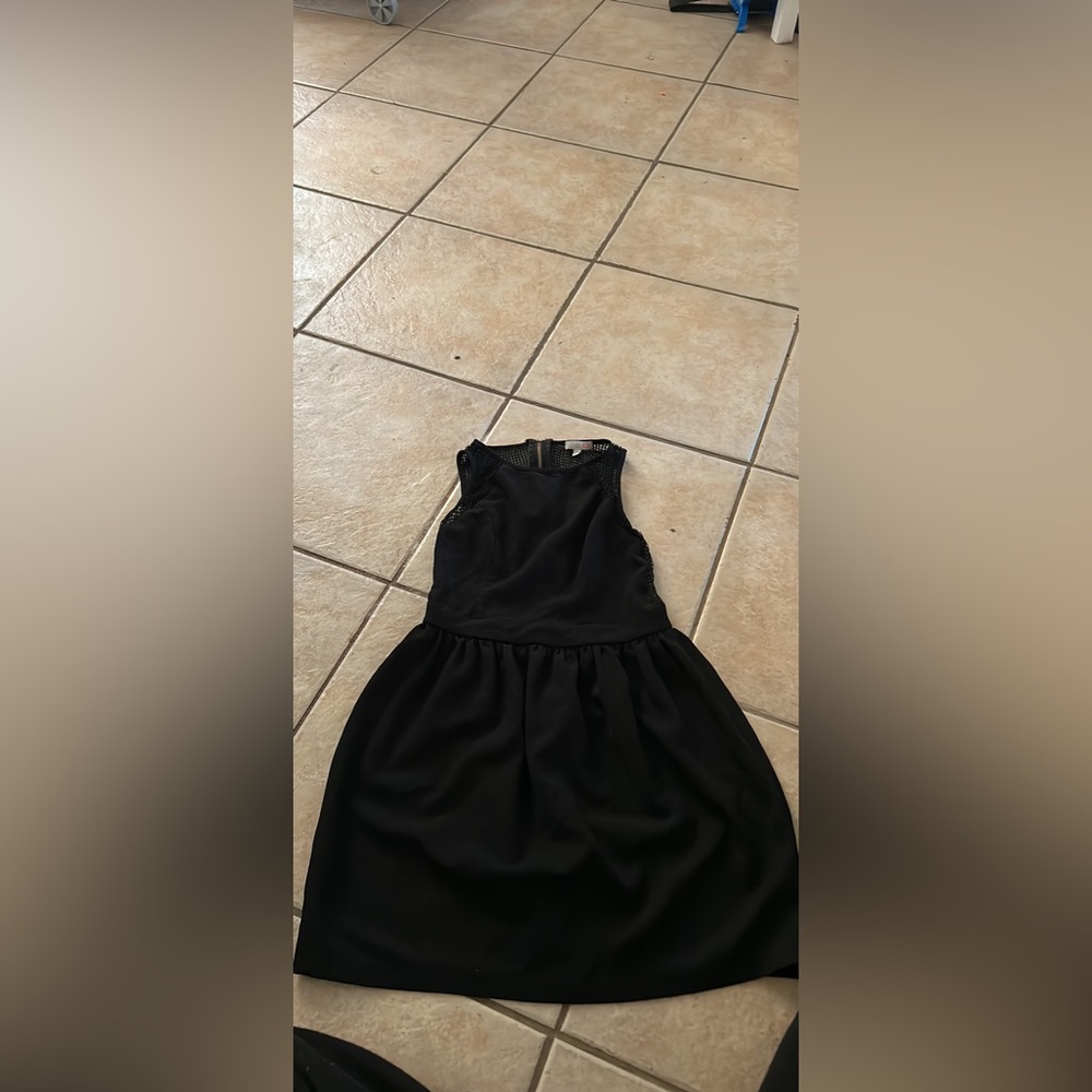 This dress is a M it’s supper cute fits perfect and no time to wear it